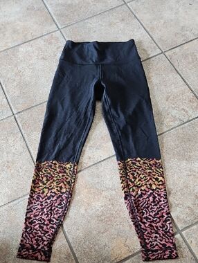 lululemon Black Leggings with Pink and Gold Accent Hem